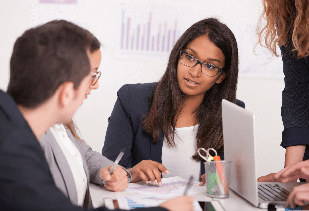 Young couple signing a contract on a meeting with investment agent in the office.